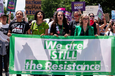 The Women's March hosts a rally and march to the Supreme Court on the first anniversary of the Dobbs V. JWHO decision, which reversed the federal right to abortion that stood for 49 years. It returned regulation of abortion to the states, and roughly half acted to ban it immediately. Some of those bans have been reversed by federal court, and more await hearings and decisions.